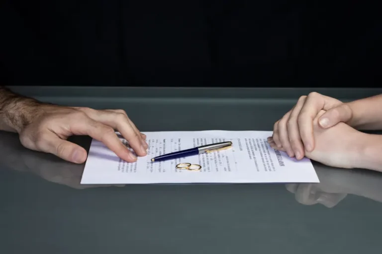 Downloaded Couple goes through divorce signing papers