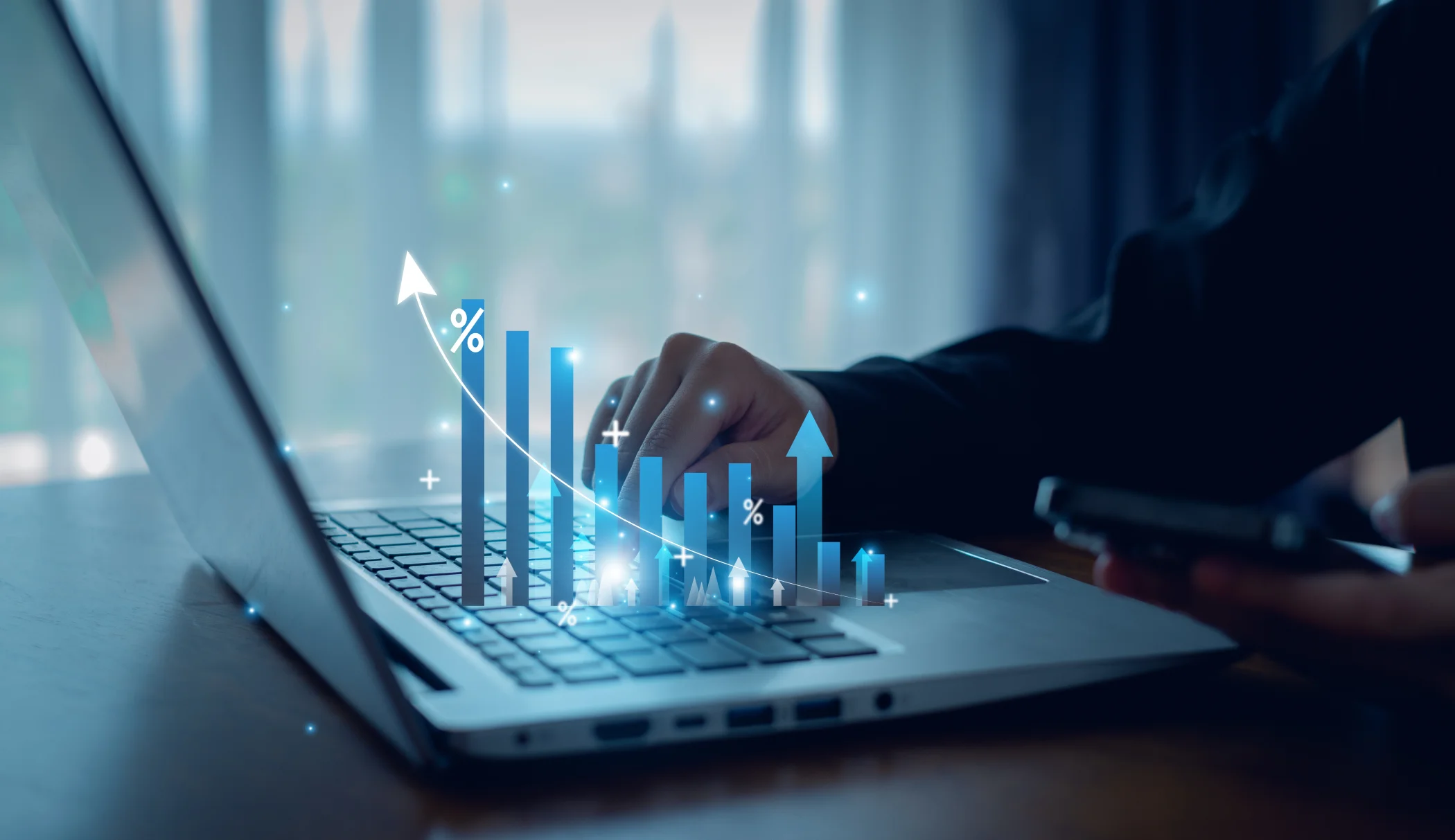 intangible assets concept with bar graph across laptop