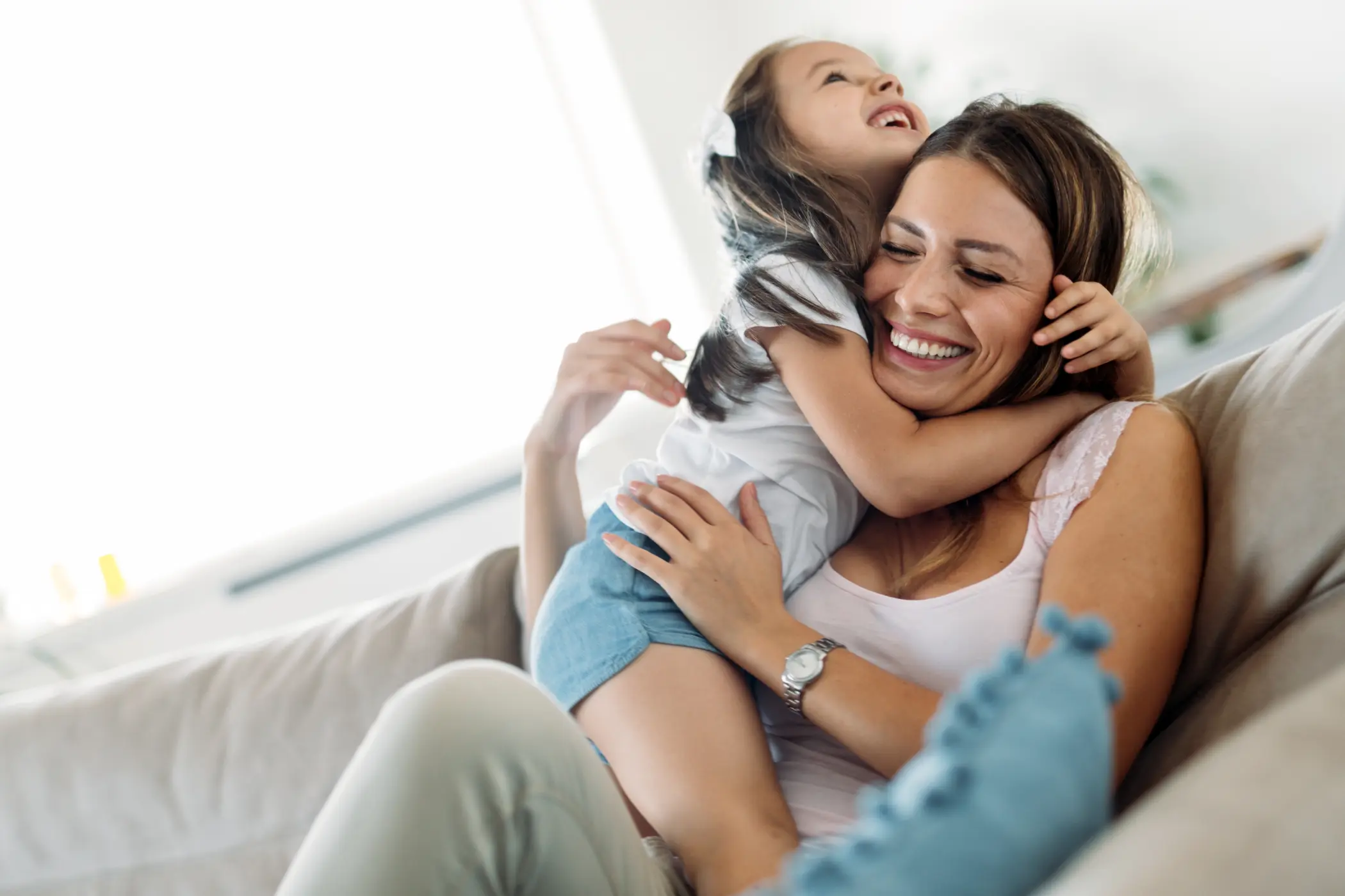 happy mother and daughter at home