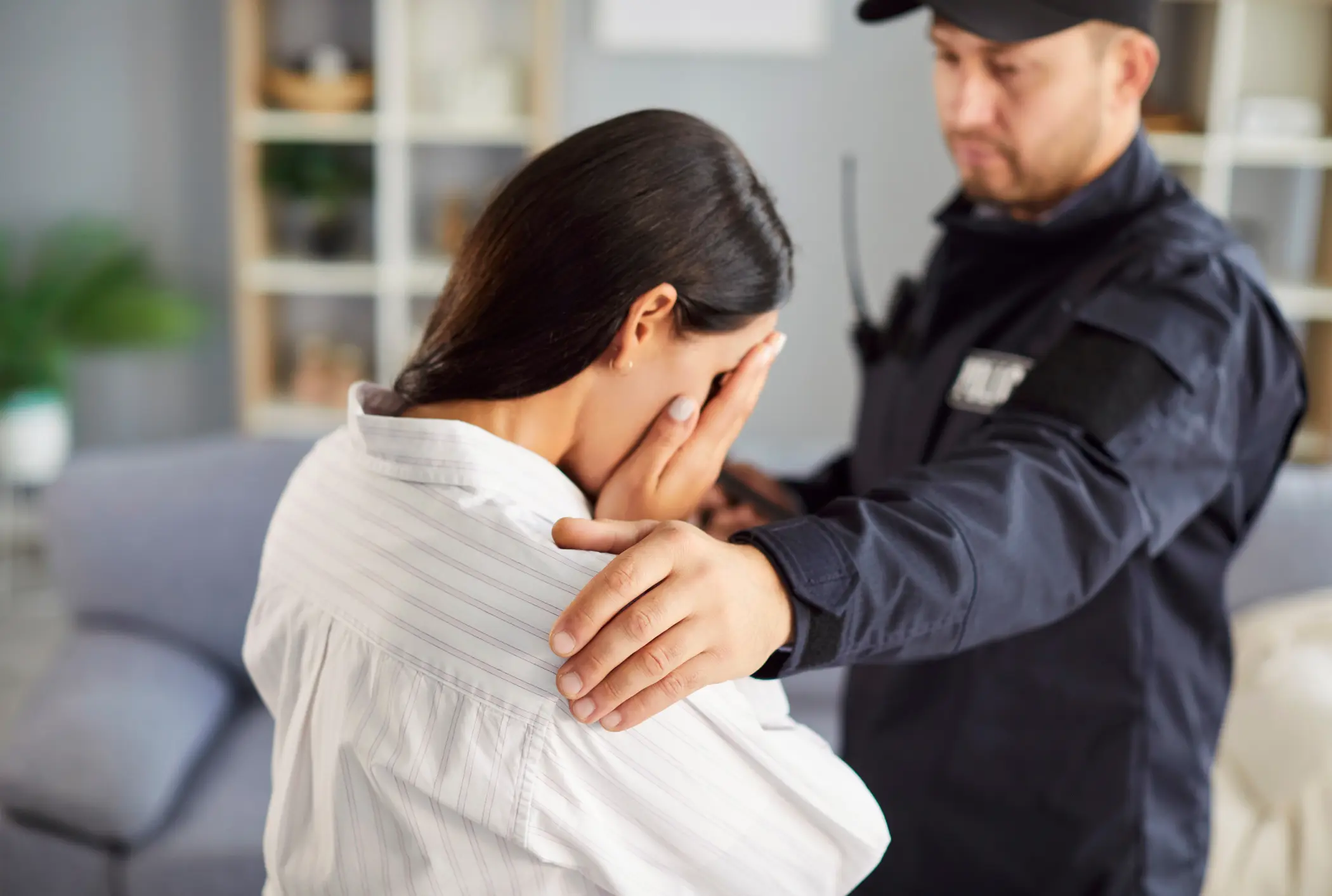 law enforcement helps woman crying domestic violence case