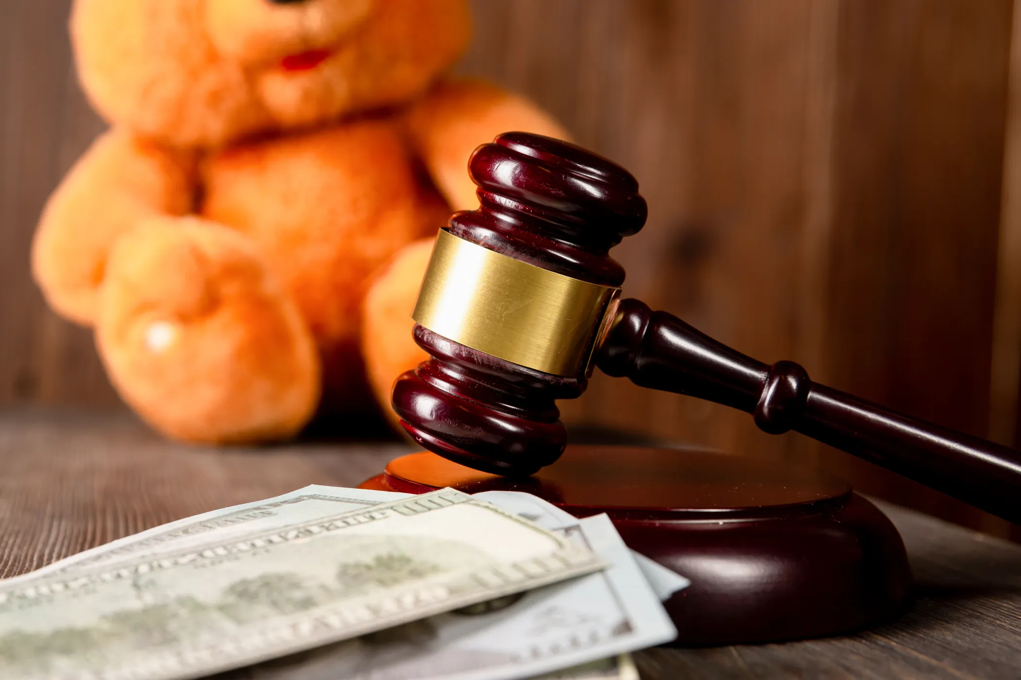 avel by teddy bear and paper money basic child support obligations concept