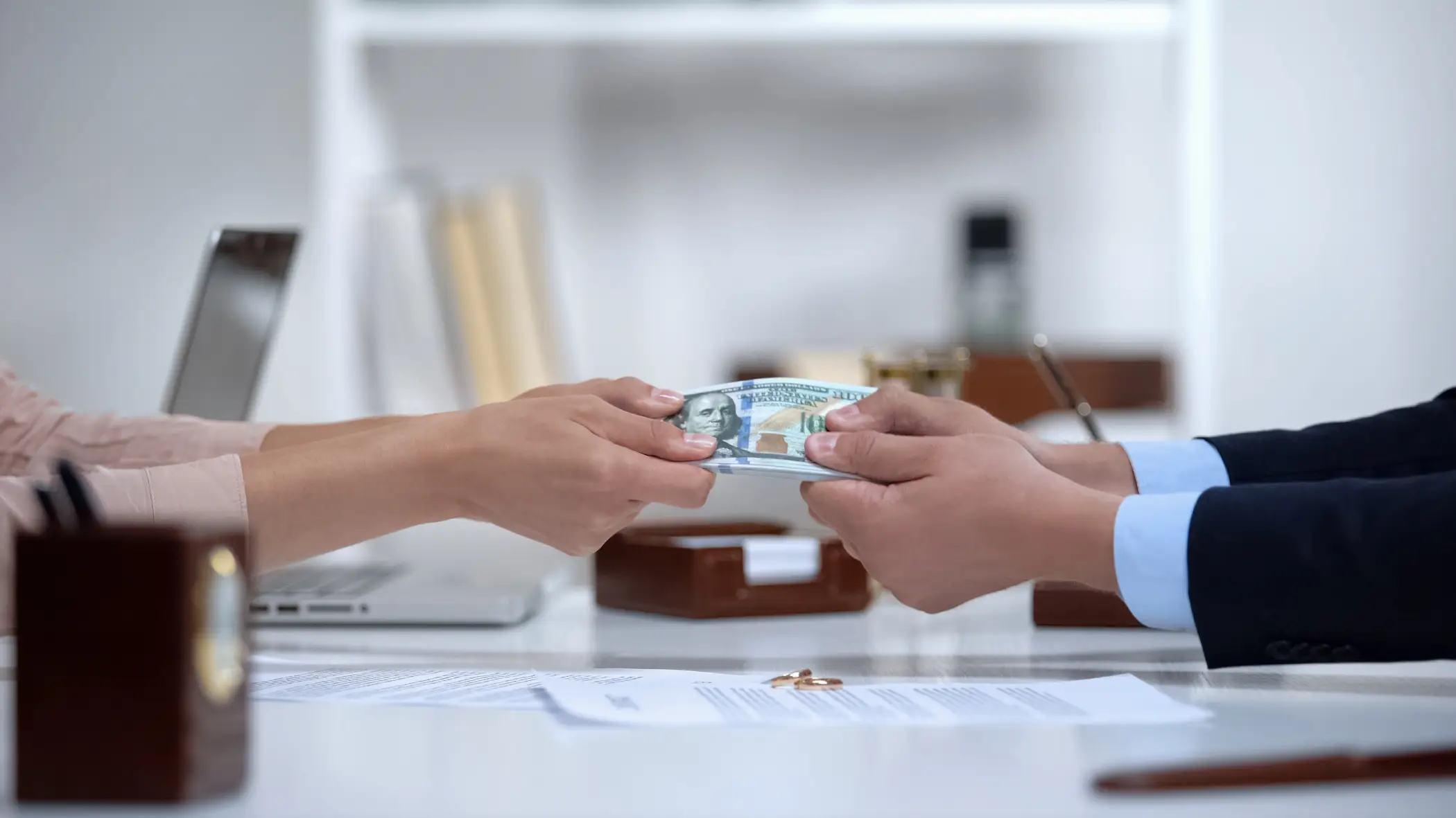 tug of war over stack of paper money during strategic property division divorce case