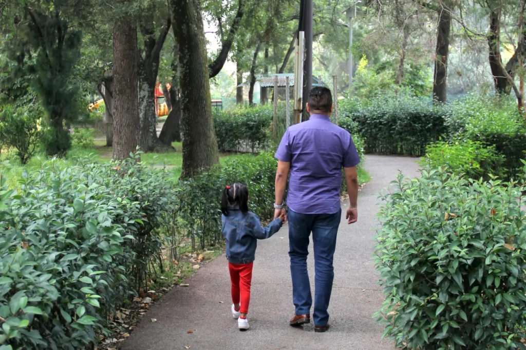 multicultural father and daughter walk hand in hand divorce case bilingual support concept